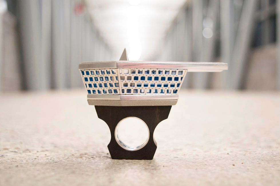 Rind made out of silver, ebony, cement, powder coat, and 24k gold leaf